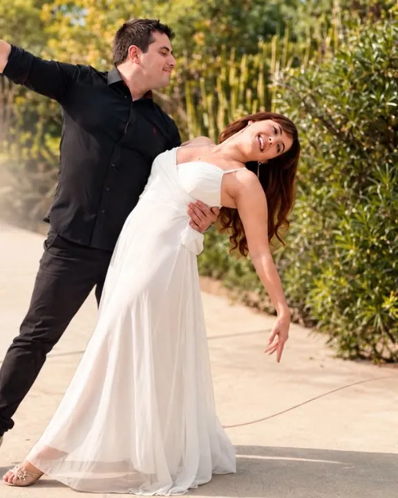 Couple dancing the Until I Found You choreography in a garden